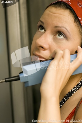 Image of girl having a call on a telephone