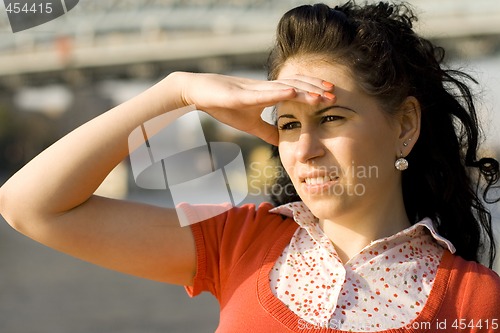 Image of woman looking at river water