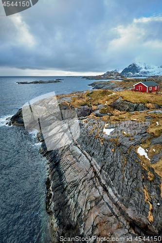 Image of Clif with traditional red rorbu house on Lofoten Islands, Norway