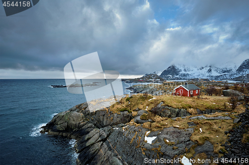 Image of Clif with traditional red rorbu house on Lofoten Islands, Norway