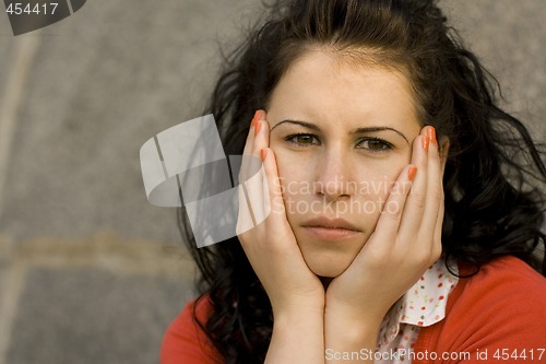 Image of young unhappy woman