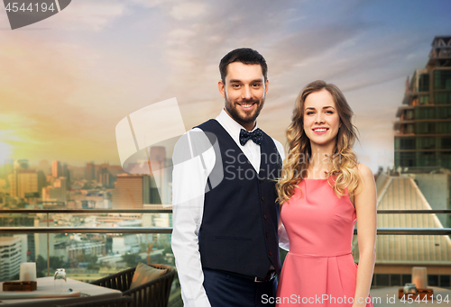 Image of happy couple over restaurant lounge in singapore