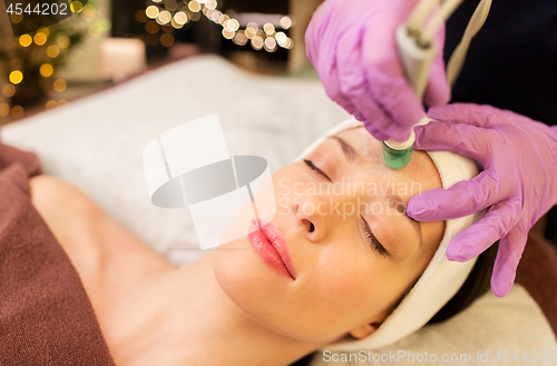 Image of woman having microdermabrasion facial treatment