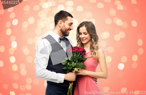 Image of couple with bunch of flowers on valentines day