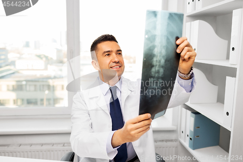 Image of doctor with x-ray scan at hospital