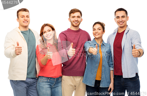 Image of group of smiling friends showing thumbs up