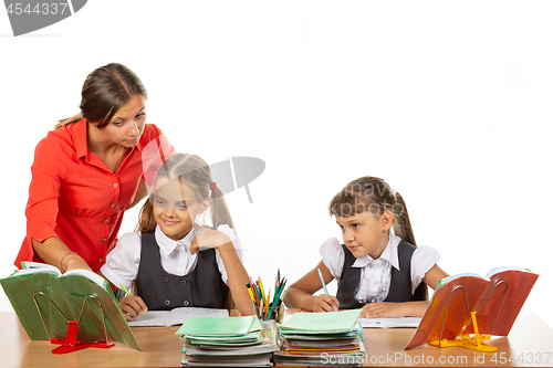 Image of The teacher helps to understand the task of the student