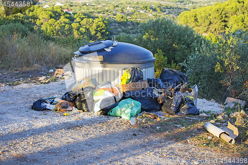 Image of Trash container full with garbage