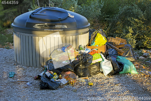 Image of Trash container full with garbage