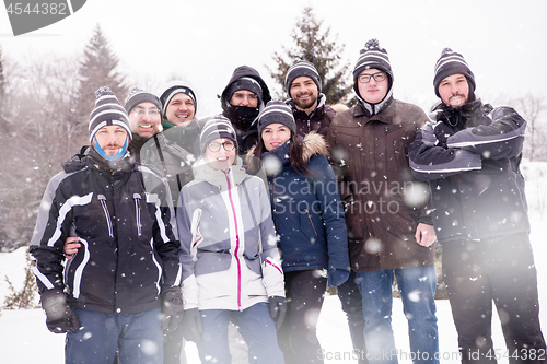 Image of portrait of group young people in beautiful winter landscape