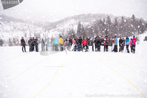 Image of group of young people having a running in bag competition