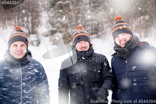 Image of portrait of group young people in beautiful winter landscape