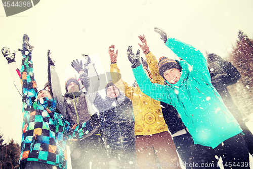 Image of group of young people throwing snow in the air