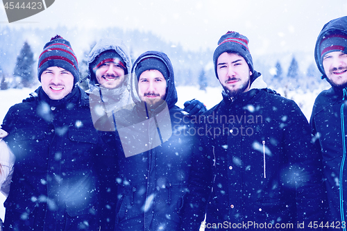 Image of portrait of group young people in beautiful winter landscape