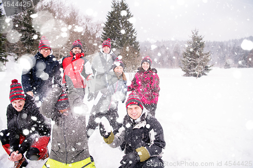 Image of group of young people throwing snow in the air