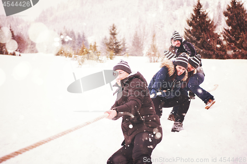 Image of group of young people pulling a rope in tug of war competition