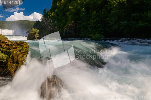 Image of single stone in wild river