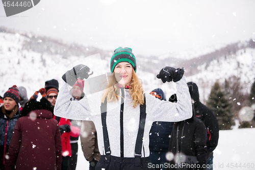 Image of portrait of young woman in beautiful winter landscape