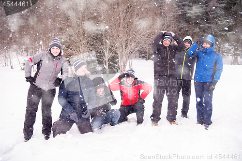 Image of portrait of group young people in beautiful winter landscape