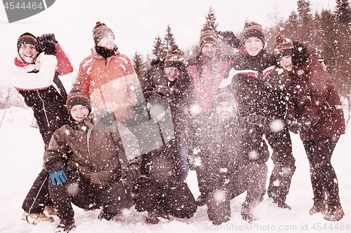 Image of group of young people throwing snow in the air