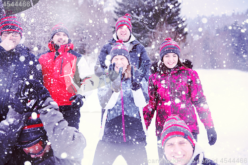 Image of group of young people throwing snow in the air