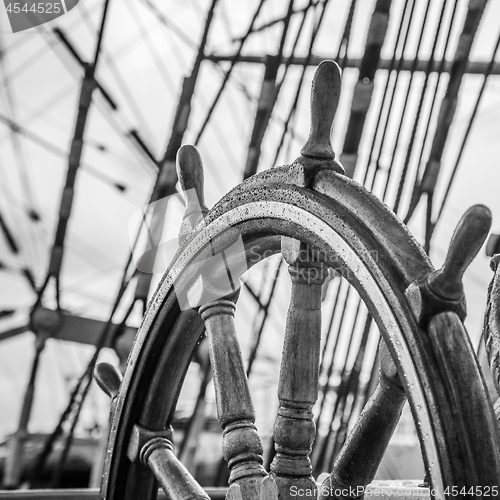 Image of Ship\'s Bell and wheel the old sailboat, close-up 