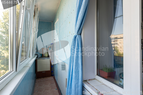 Image of The interior of the glazed spacious balcony of the apartment