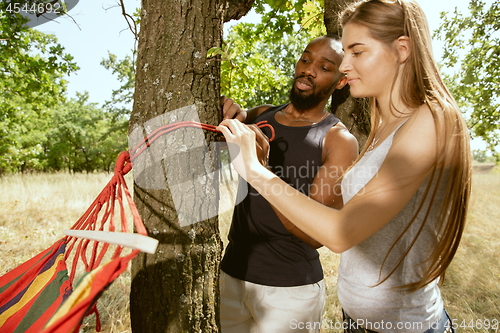 Image of Young multiethnic international couple outdoors