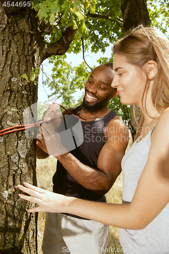 Image of Young multiethnic international couple outdoors