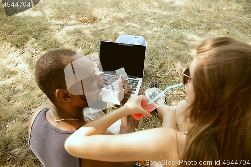 Image of Young multiethnic international couple outdoors