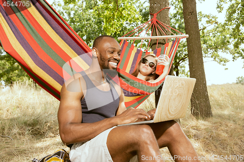 Image of Young multiethnic international couple outdoors