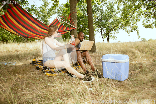 Image of Young multiethnic international couple outdoors