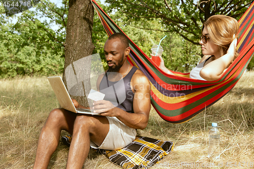 Image of Young multiethnic international couple outdoors