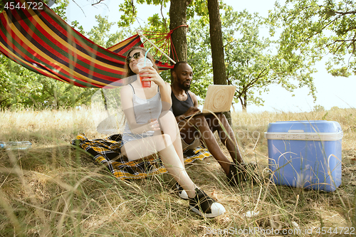 Image of Young multiethnic international couple outdoors