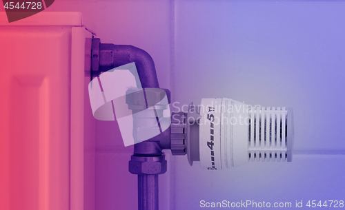 Image of Temperature knob of heating radiator, used and dusty