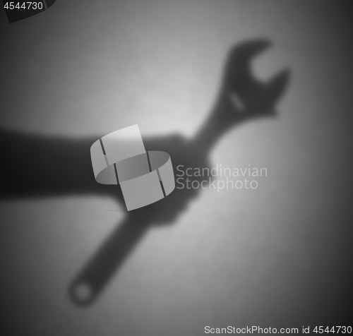 Image of Silhouette behind a transparent paper, blurred