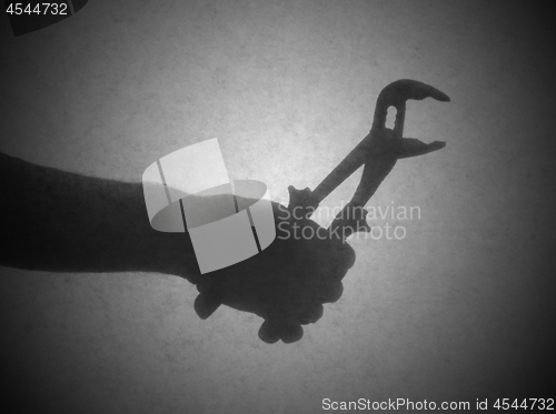 Image of Silhouette behind a transparent paper