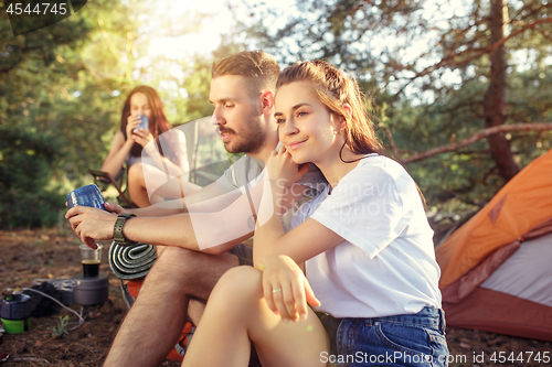 Image of Party, camping of men and women group at forest. They relaxing