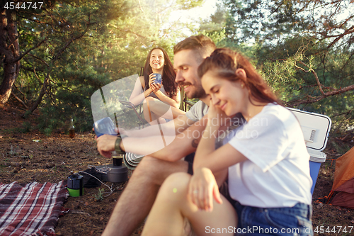 Image of Party, camping of men and women group at forest. They relaxing