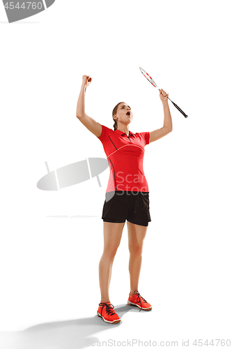 Image of Young woman badminton player as winner posing over white background