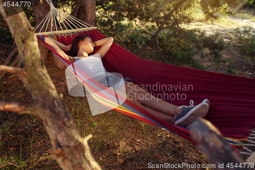 Image of Party, camping. Woman sleeping at forest. She relaxing