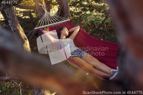 Image of Party, camping. Woman sleeping at forest. She relaxing