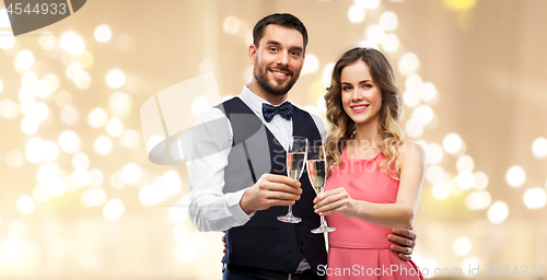 Image of happy couple with champagne glasses toasting