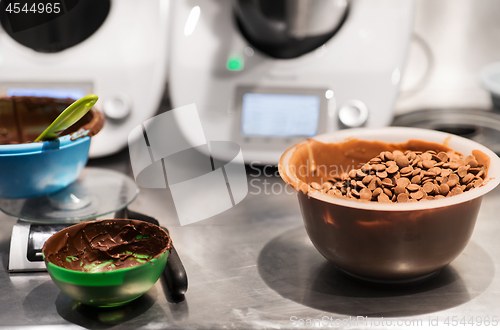 Image of chocolate buttons in bowl at confectionery shop