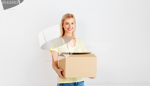 Image of happy woman holding cardboard box