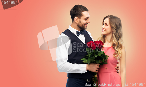 Image of couple with bunch of flowers on valentines day