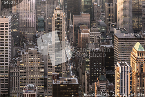 Image of New York City skyline with urban skyscrapers at sunset, USA.