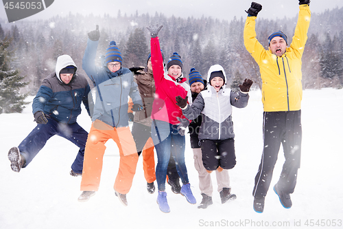 Image of portrait of group young people in beautiful winter landscape