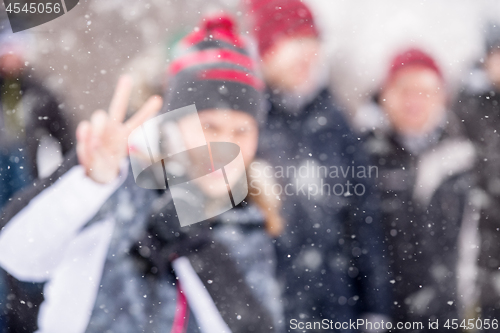 Image of Abstract blurred photo of young woman in beautiful winter landsc