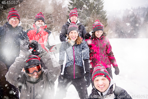 Image of portrait of group young people in beautiful winter landscape